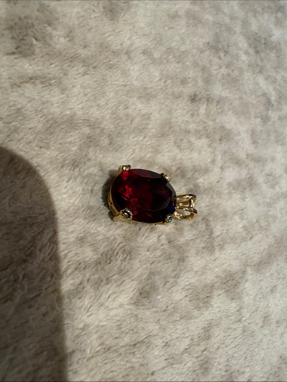 Gold Pendant with Deep Red Oval Gemstone